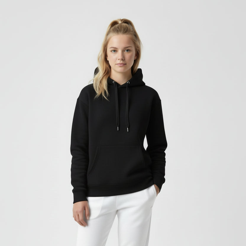 Person wearing a black hoodie and white pants on a light gray background